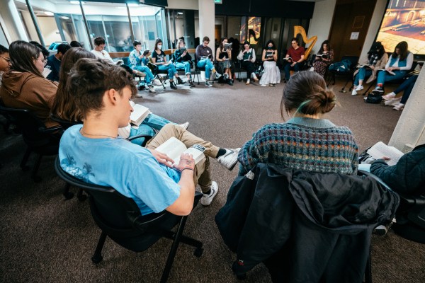 Attendees form a circle to relish as they read the poetry of Beowulf