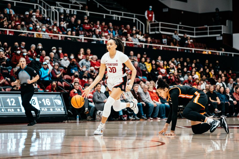 A basketball player dribbles