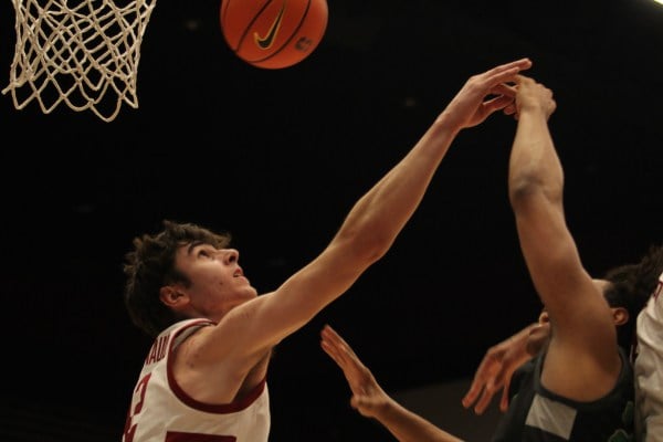 Sophomore center Maxime Raynaud contests a shot at the rim against Chicago State on Wednesday. Raynaud had 15 points against Cal on Saturday. (Photo: RANA TAKI/The Stanford Daily)