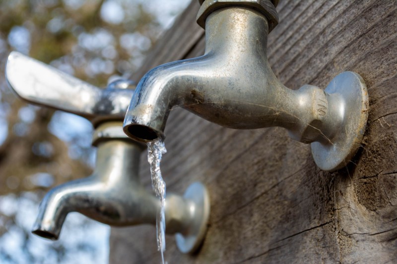 A spigot leaking water.