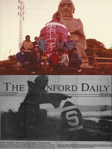 A group of students in front of a football statue.