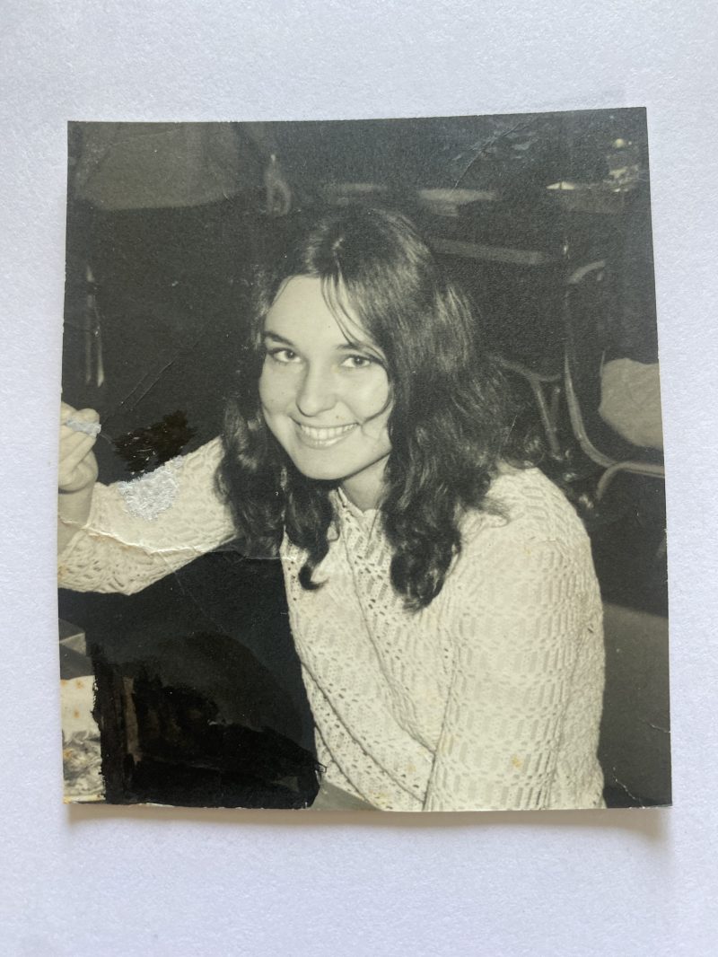 A young woman in a black and white photo.