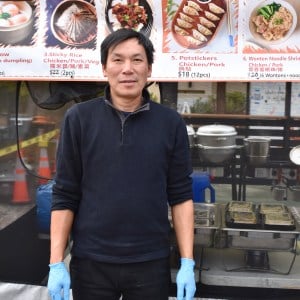 Anson Lin stands in front of his stall.