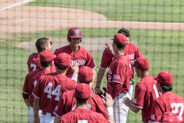 Players smiling in red jerseys.