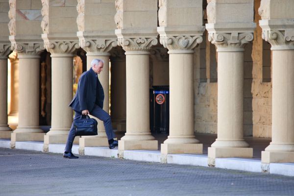 Tessier-Lavigne walking in Stanford's main quad