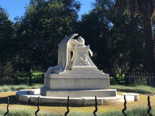 The Angel of Grief rests in the middle of a clearing.