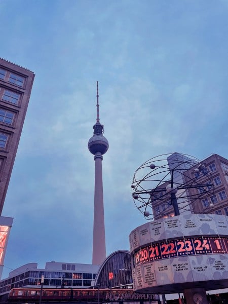 Cloudy day in Berlin. Movie theater in the bottom right. An observation tower rises in the center.