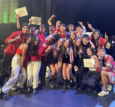 A group photo of Mixed Co members wearing red