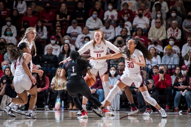 Stanford players on defense during a basketball game against South Carolina.