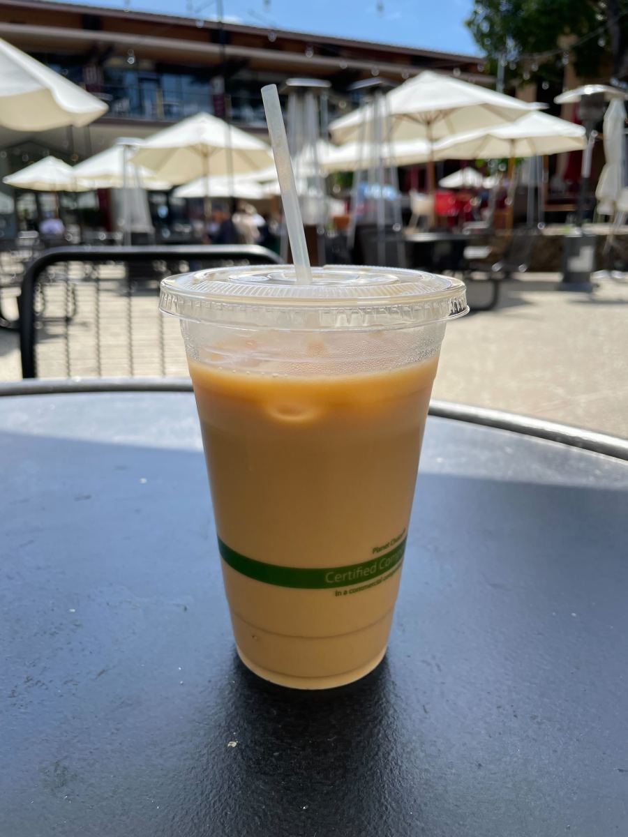 The CoHo iced latte drink sits on a CoHo table in Tresidder.