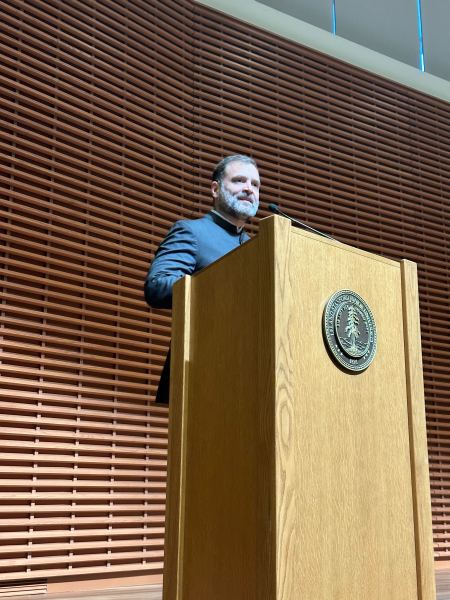 Rahul Gandhi standing at a podium in CEMEX Auditorium