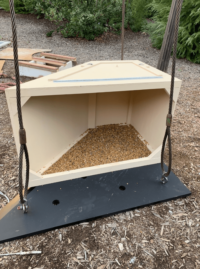 A wooden box with one open side to fit a falcon nest