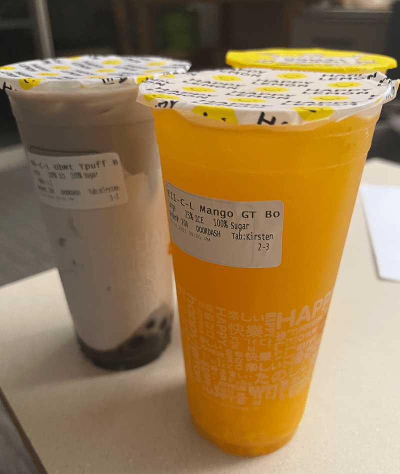 The taro ume and mango drinks from Happy Lemon are set up on a table. 