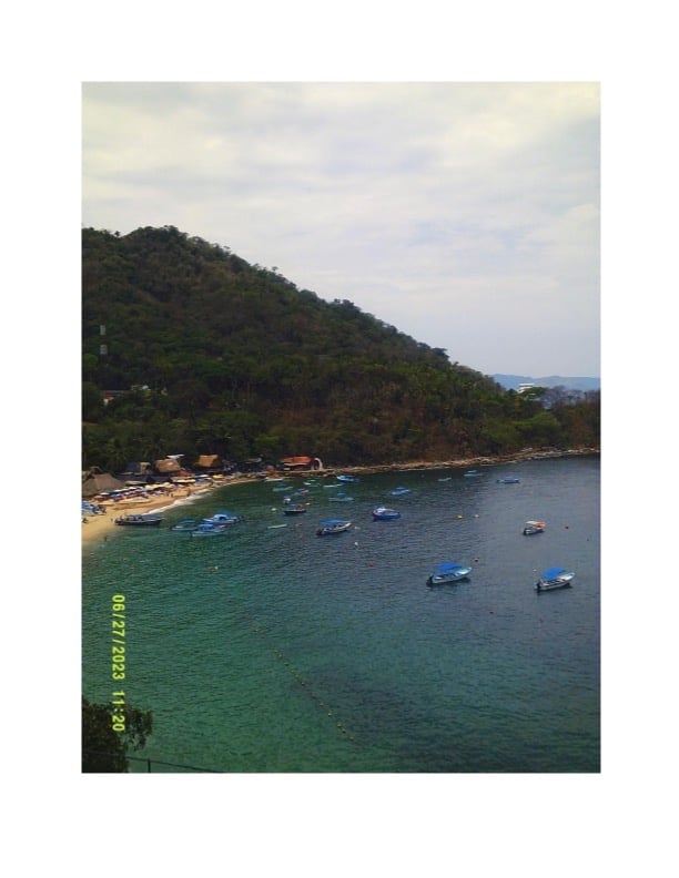 a photo of a cove with several boats in the water