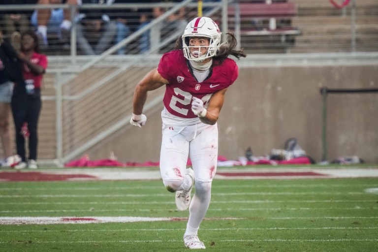 A football player runs forward