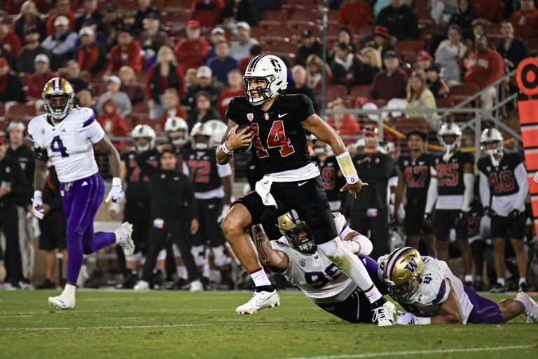 Ashton Daniels runs with the football.