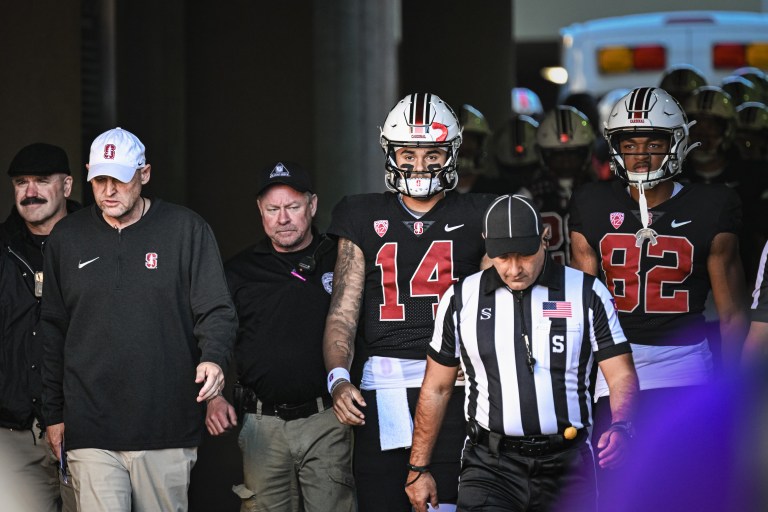 Quarterback Ashton Daniels leads the team out of the tunnel. (Photo: CAYDEN GU/The Stanford Daily)