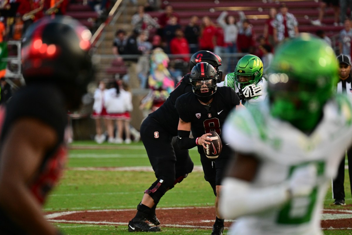 Justin Lamson scrambles against Oregon