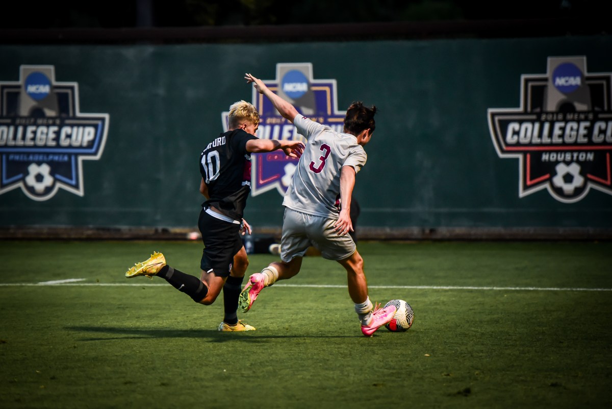 Zach Bohane challenges Santa Clara defender Keagan Rhodes for the ball