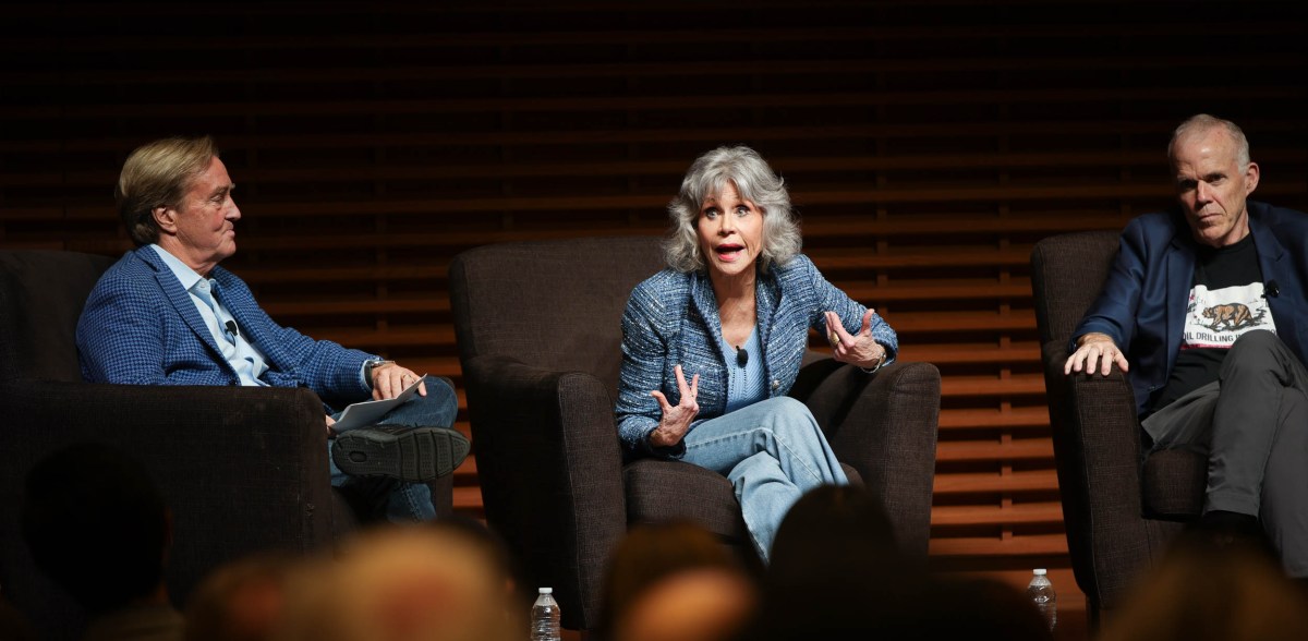 Jane Fonda emotes while speaking, eyes wide and fingers splayed. 