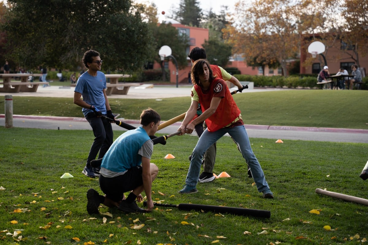 People fighting with foam swords