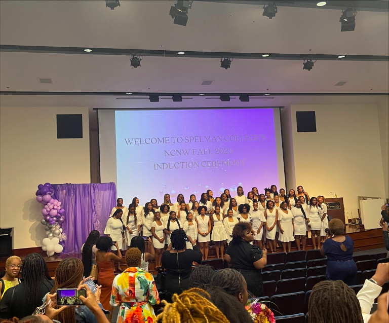 A large group of Black female students stand for a photo.