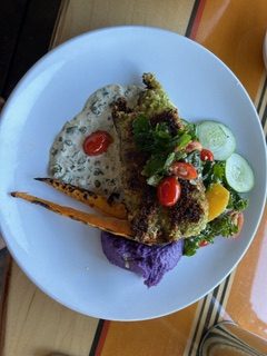 A plate full of colorful food.