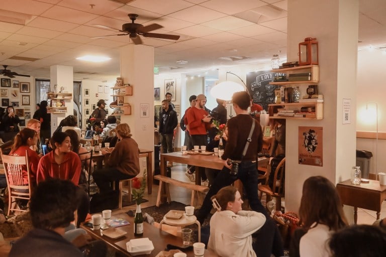 Students are talking, sitting at tables, and enjoying snacks and drinks at On Call Café's new location in Old Union.