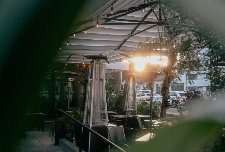 A cozy outdoor dining parklet.