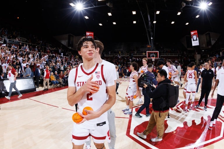 Andrej Stojakovic standing on the court of Maples Pavilion after a game.