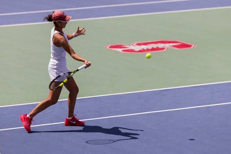 Connie Ma returns a hit on the Stanford tennis courts.