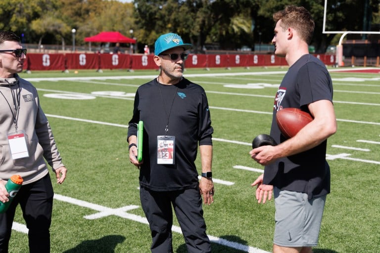 Josh Karty talks with a Jaguars scout.