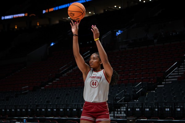 Kiki Iriafen shoots a jump shot at the Moda Center.