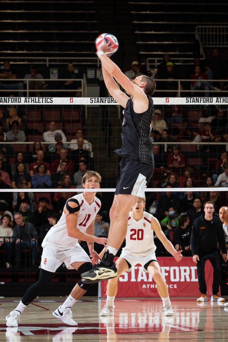 Nathan Lietzke sets a ball against USC