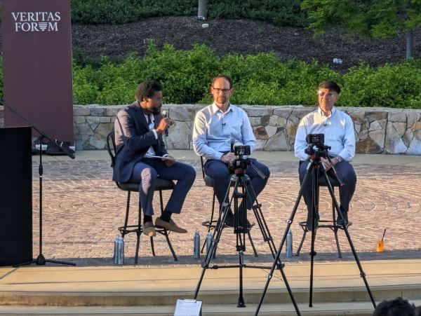 David Spiegel (right) and David Carreon (middle) talked to George Muirhead JD ’24 on Thursday at an event hosted by the Veritas Forum on happiness and whether it's an illusion.