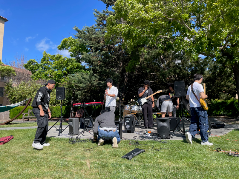 Members from Six of Spades, Peach Fuzz and The Move set up for Spade Rave in Casper Quad.