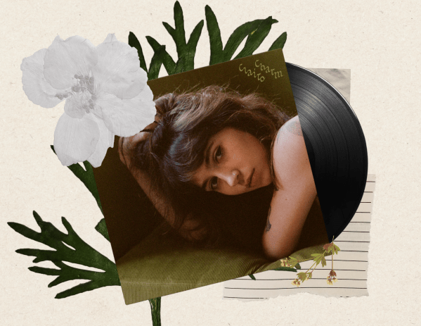 An image of the vinyl for Clairo's "Charm" surrounded by leaves, flowers and scraps of paper.