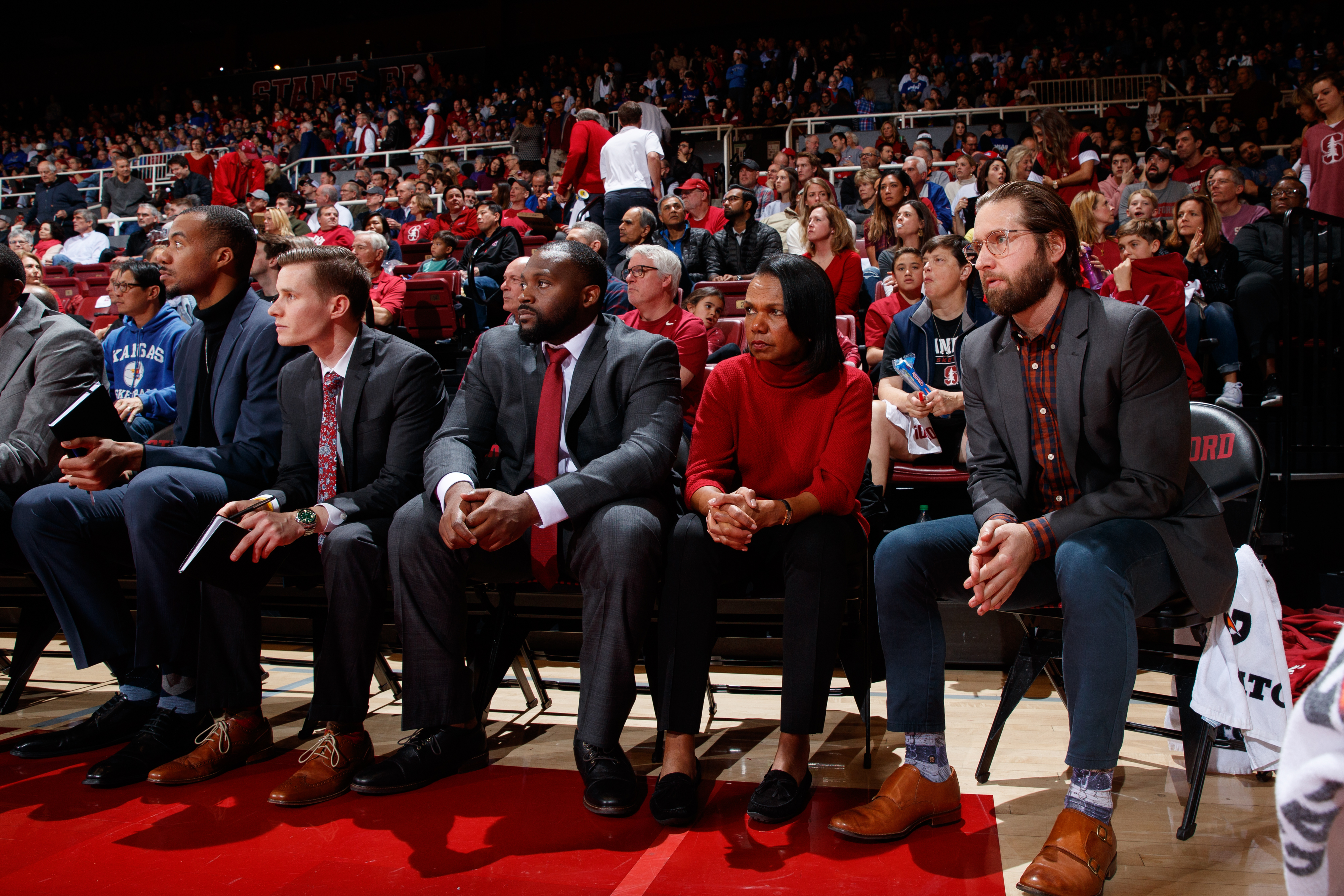 A group of people a a basketball game.