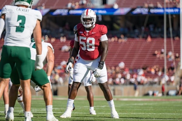 Stanford football player lines up for an offensive play.