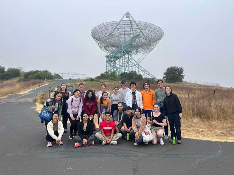 A group of students pose for a picture at the Dish.