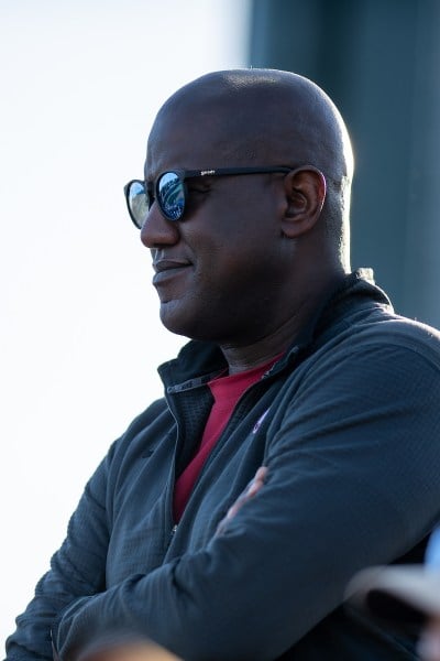 Bernard Muir watches softball game.