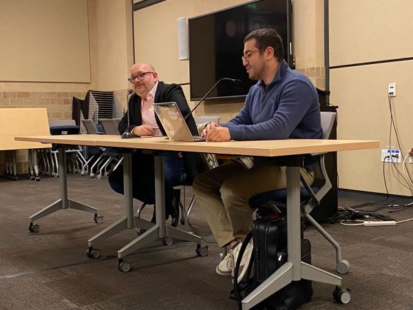 journalist Jason Rezaian speaks in Encina Commons, seated at a table