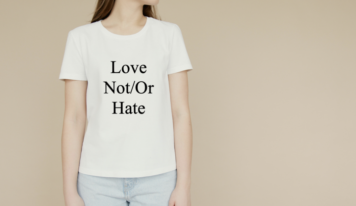 A white T shirt with the writing "Love Not/Or Hate."