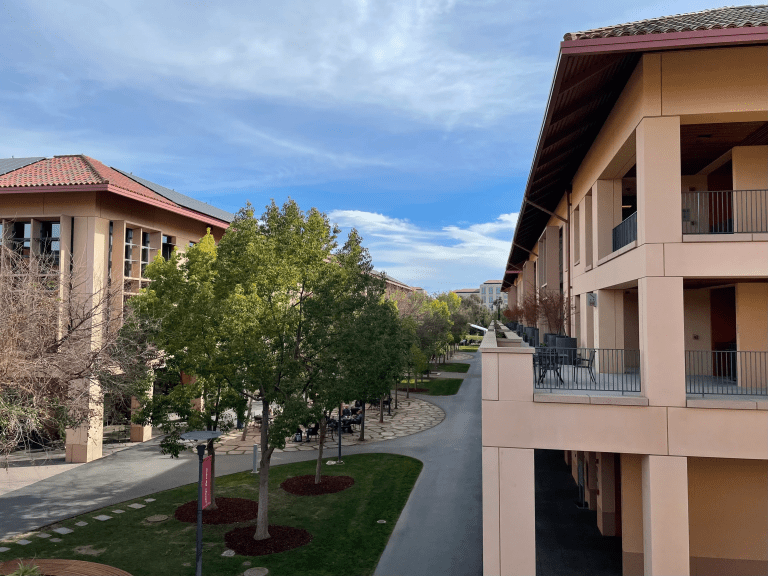 A photo from the balcony of a building at Knight Management Center; sky is light blue with some clouds.