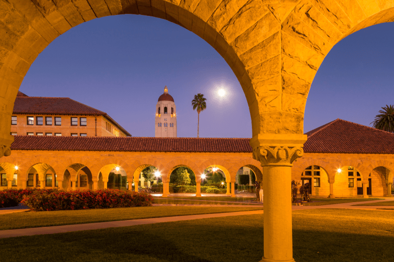 Arches and Hoover Tower visible at dusk