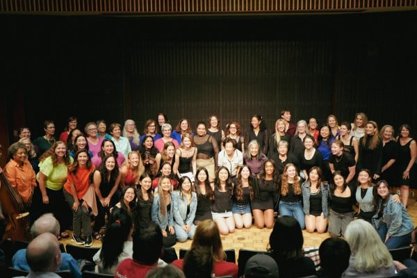 Multiple generations of Counterpoint members pose for a group photo.