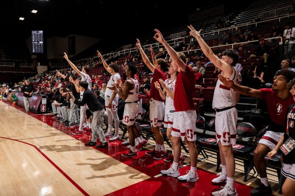 Stanford bench celebrates during a game against Utah Valley at Maples Pavilion.