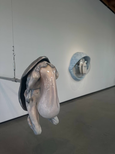 Display of “Post Human” at Gallery Jeffrey Deitch, a sculpture of a skin and flesh-like blob attached to a crustaceous shell